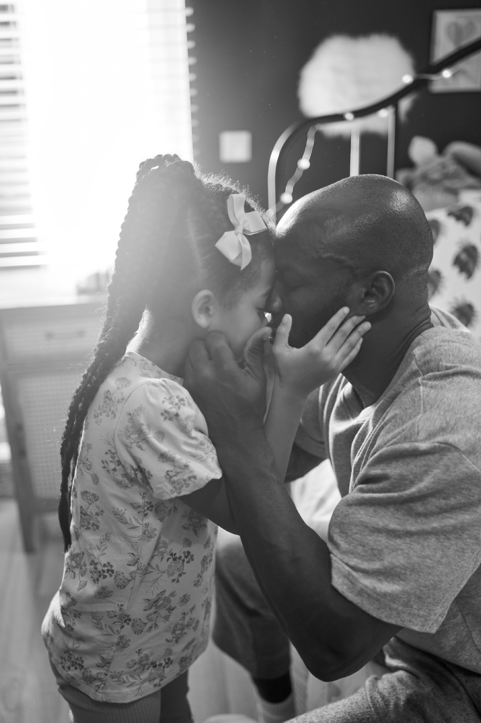 An emotional pause — tender presence between father and daughter